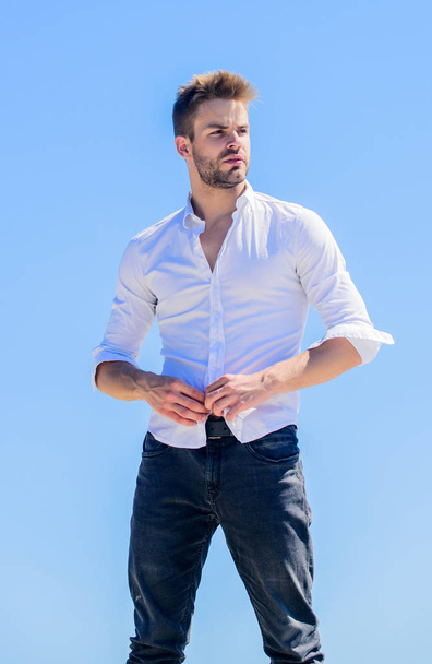 Hot day outdoors. Heat season. Formal fashion. Formal style. Attractive man taking off shirt. Confident in his appealing. Bearded guy business style. Handsome man fashion model. Sexy macho man - 写真・画像