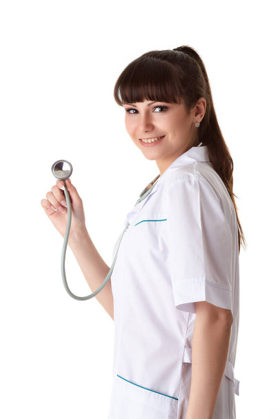 Smiling beautiful doctor with stethoscope on a  white background. Medical concept. - Fotoğraf, Görsel