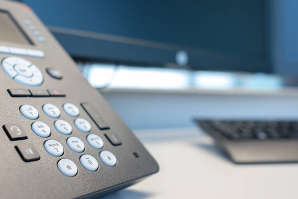 keyboard phone with monitor in a modern office in landscape orientation - Fotó, kép