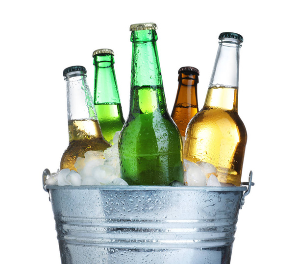 Beer in metal bucket with ice isolated on white - Foto, Imagem