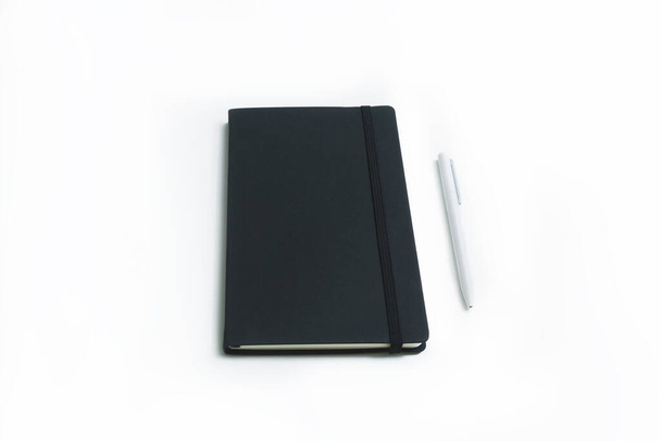 Notebook and white pen isolated on white background - Foto, imagen
