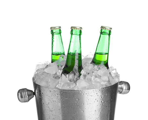 Beer in metal bucket with ice isolated on white - Zdjęcie, obraz