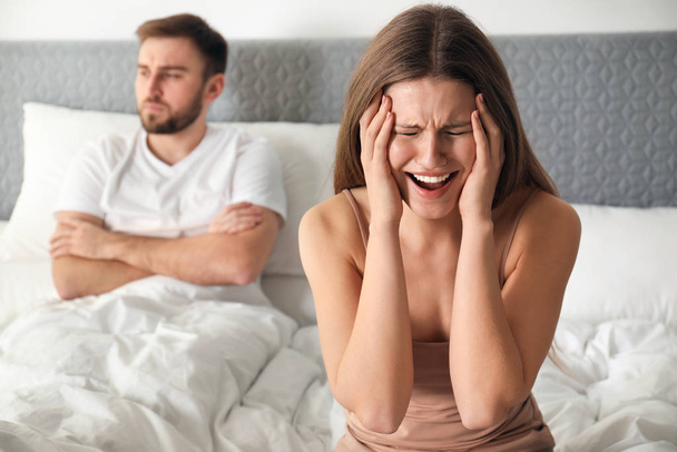 Unhappy couple with relationship problems after quarrel in bedro - Фото, изображение