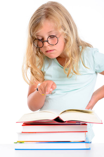sweet funny girl with pile of books and round glasses - Фото, изображение