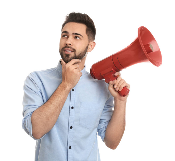 Young man with megaphone on white background - Fotografie, Obrázek