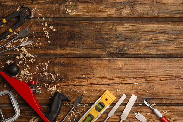 Flat lay composition with carpenter's tools on wooden background. Space for text - Foto, immagini