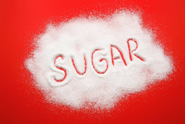 Composition with word SUGAR on red background, top view - Photo, Image