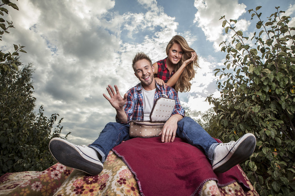 Positive young couple spending time outdoors. - Fotografie, Obrázek
