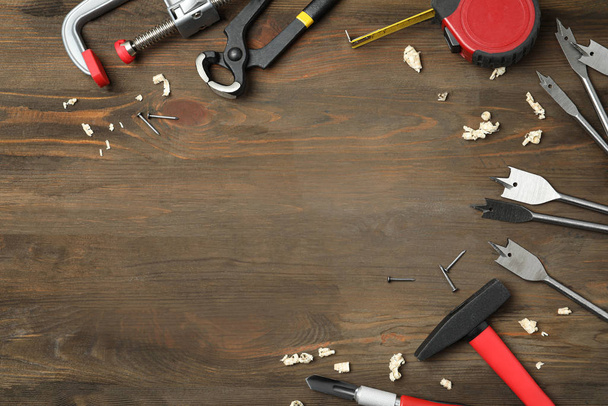 Flat lay composition with carpenter's tools on wooden background - Valokuva, kuva