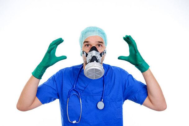young doctor with gas mask in front of white background - Foto, Imagem