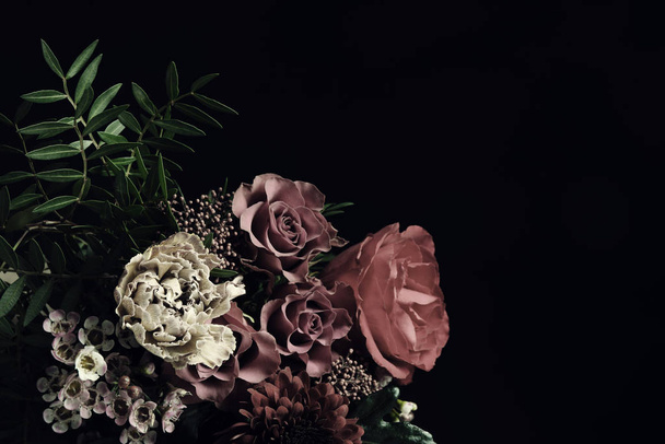 Beautiful bouquet of different flowers on black background, space for text. Floral card design with dark vintage effect - Photo, Image