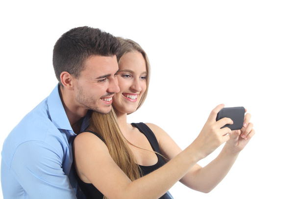 Couple watching social media on the smart phone - Foto, afbeelding