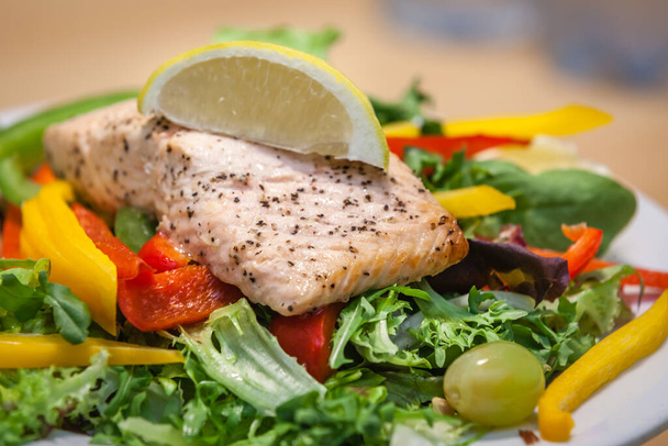 Roast salmon and peppers salad prepared for lunch - Foto, Imagen