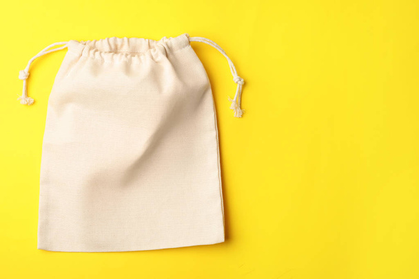 Cotton eco bag on yellow background, top view. Space for text - Fotografie, Obrázek