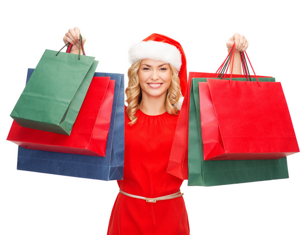 Woman in red dress with shopping bags - Photo, Image