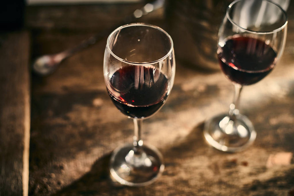 Red wine on wood background - Photo, Image