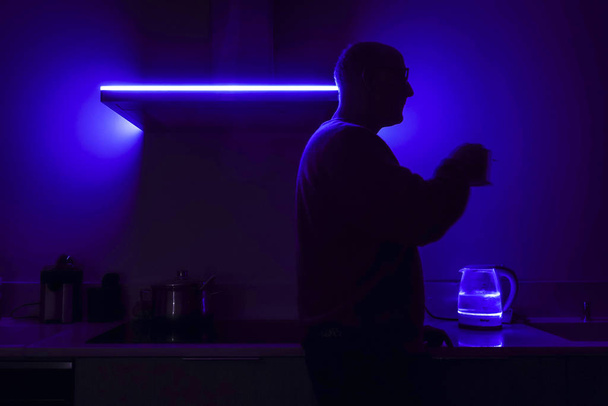 Boston, Mass, USA A man prepares coffee in a modern kitchen. - Photo, Image