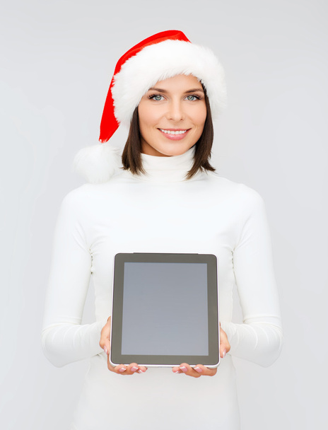 Woman in santa helper hat with tablet pc - Foto, imagen