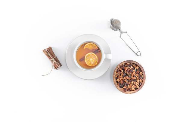 Fruit tea with cinnamon and dried orange in cup - teacup with st - Fotó, kép