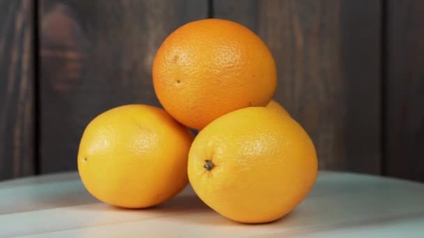 oranges on the wooden table  - Video, Çekim