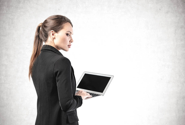 Side view of businesswoman with laptop, isolated - Foto, Imagem