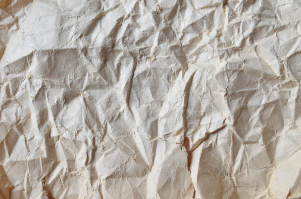 Buruşmuş kağıtlarla kaplanmış yaratıcı bir arka plan.. - Fotoğraf, Görsel
