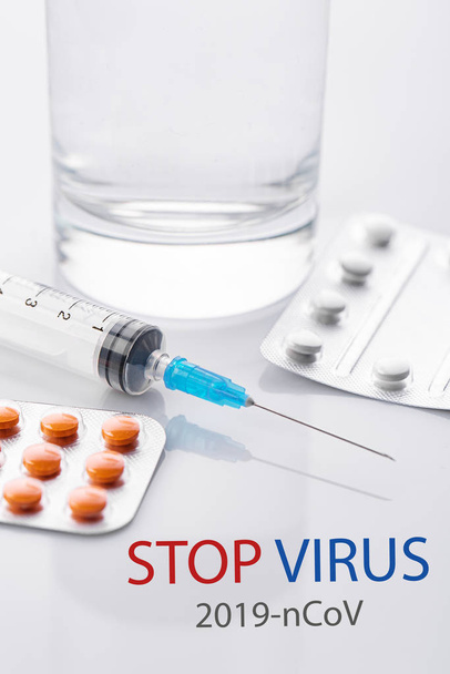 Coronavirus 2019-nCoV. Novel coronavirus, Middle East Respiratory Syndrome. Pills with STOP VIRUS text. Chinese coronavirus outbreak. Virus Pandemic Protection Concept - Fotografie, Obrázek