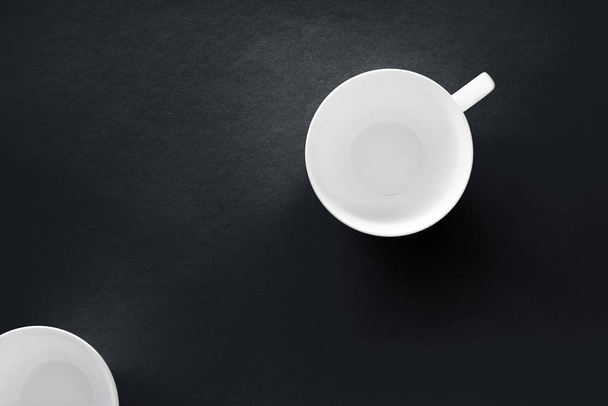 White tableware crockery set, empty cup on black flatlay backgro - Foto, Imagem