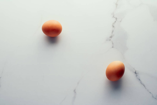 Egg on marble table as minimalistic food flat lay, top view food - Photo, Image