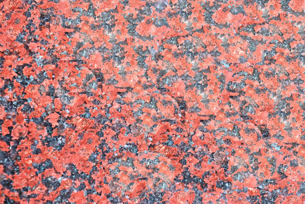 Granite texture of the material is pink tone, the relief of natural stone with its bizarre outlines. - Fotoğraf, Görsel