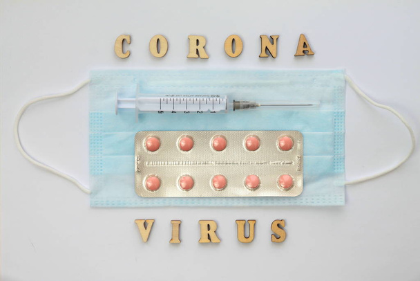 Word coronovirus in wooden letters. Global healthcare concept pandemic virus infection from Wuhan, China. Novel Coronavirus outbreak - Foto, Imagem