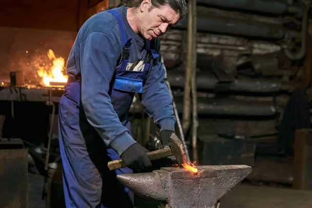 aged male blacksmith at work - Photo, Image