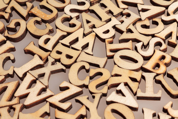 wooden letters of the English alphabet workpiece closeup macro - Foto, afbeelding