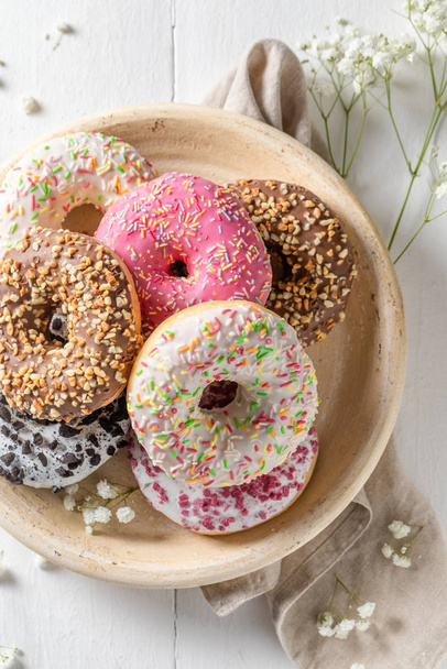 Top down view of tasty donuts with various decoration - Foto, Imagem