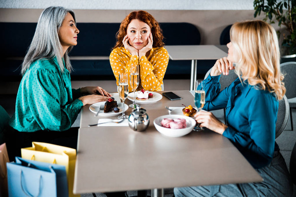 Beautiful ladies spending time together in cafe - Fotoğraf, Görsel