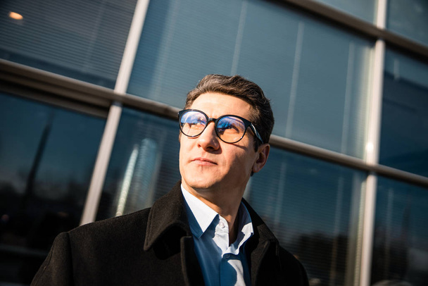 Man in eyeglasses staring into the distance - Photo, image