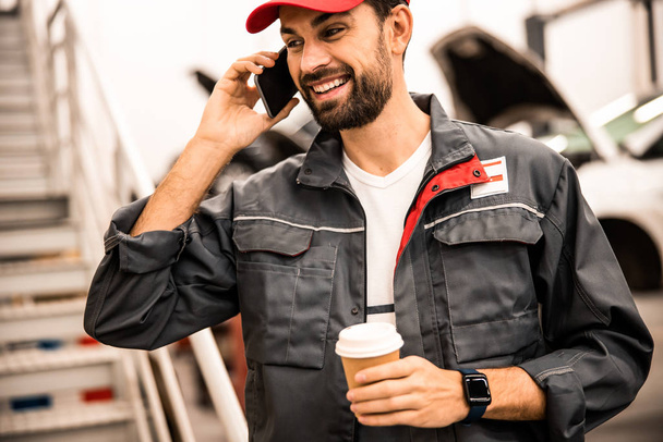 Good-looking joyful male talking on the phone - Photo, image