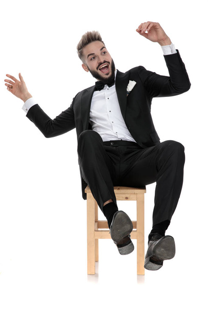 businessman sitting and playful leaning back - 写真・画像