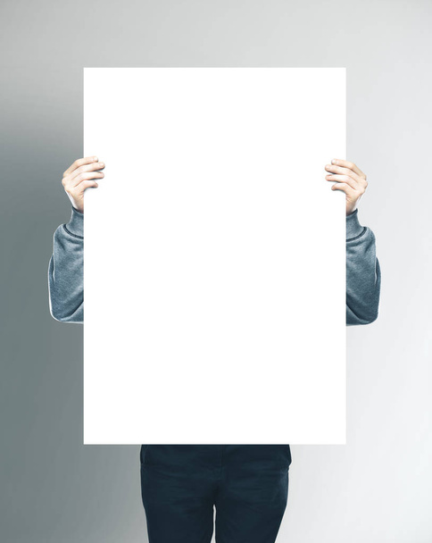 Businessman holding blank white banner - Foto, immagini