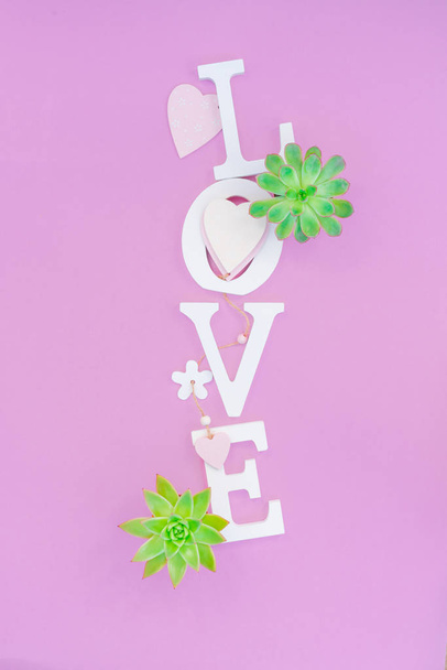Word love from white volume letters on pink background - Photo, Image