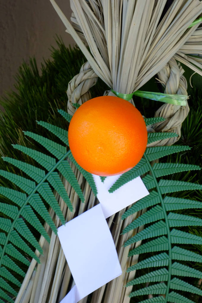 Tangerines, a god decoration on the entrance to New Year's Day                                - Φωτογραφία, εικόνα