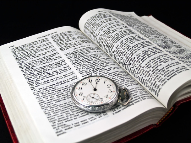 The Bible opened to Matthew 24: 36 with a Pocketwatch - Photo, Image