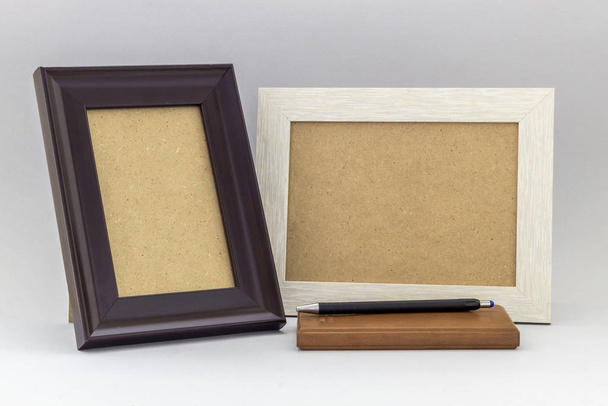 Composition Using Empty Frames, Notebook and Black Pencil on Gray Background - Фото, зображення
