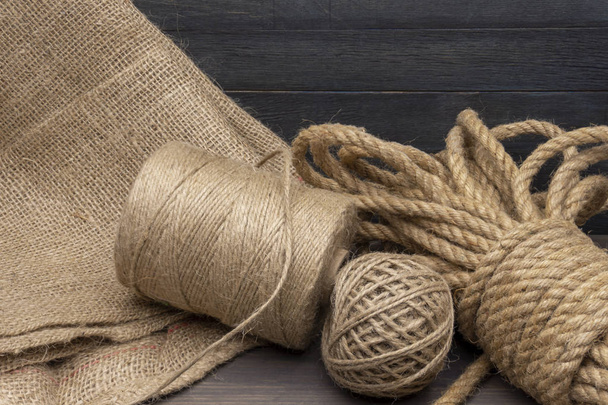 Jute rope and spools of burlap threads or twine - Foto, imagen