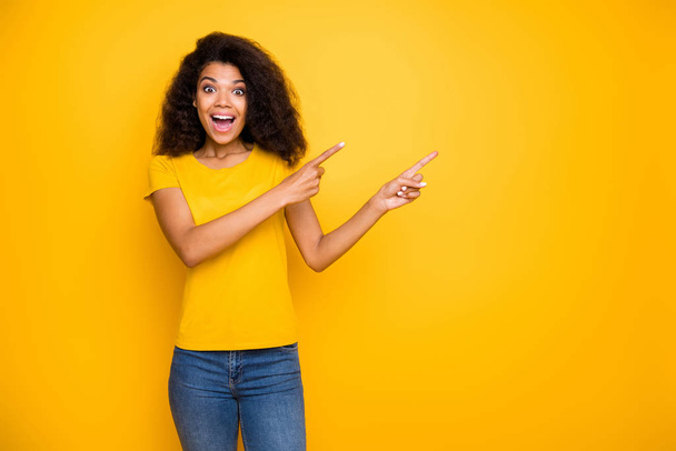 Portrait of her she nice attractive lovely excited cheerful cheery wavy-haired girl showing cool decision new novelty ad advert isolated over bright vivid shine vibrant yellow color background - Fotó, kép