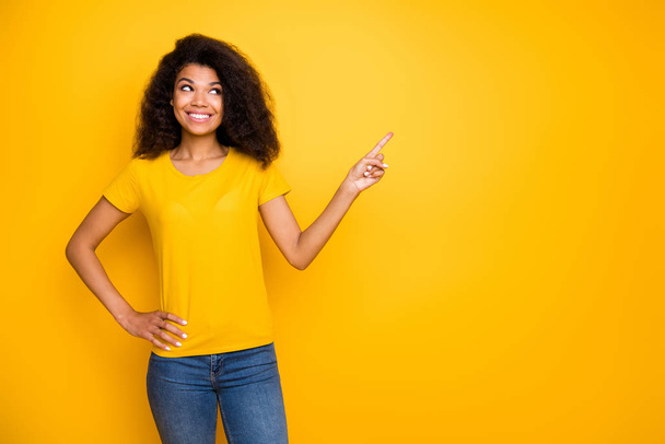Portrait of her she nice-looking attractive lovely cheerful cheery wavy-haired girl showing indicate index select option isolated over bright vivid shine vibrant yellow color background - Photo, image