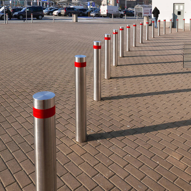 Do not park on the pedestrian pavement, the row of posts is positioned to prevent parking of vehicles ... - Photo, Image