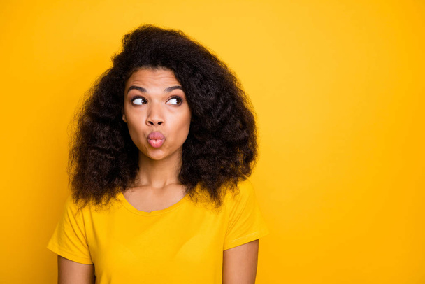 Close-up portrait of her she nice attractive lovely coquettish cheerful cheery wavy-haired girl sending air kiss looking aside isolated over bright vivid shine vibrant yellow color background - Foto, imagen
