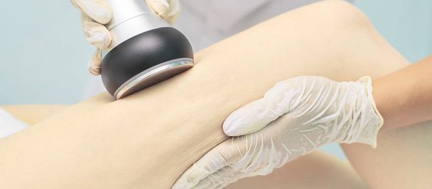 Cavitation rf body treatment. Female ultra sound lipo machine. Spa contouring. Doctor hands - Фото, изображение