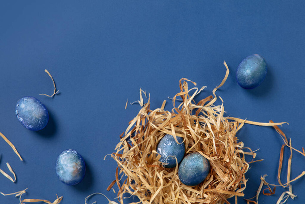 Egg hunt is coming. Easter traditions, space, cosmos colored eggs, top view - Foto, immagini